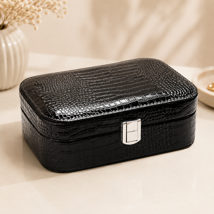 Black crocodile grain leather jewelry box closed with silver clasp