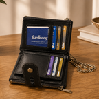 Black leather wallet open showing multiple card slots close-up