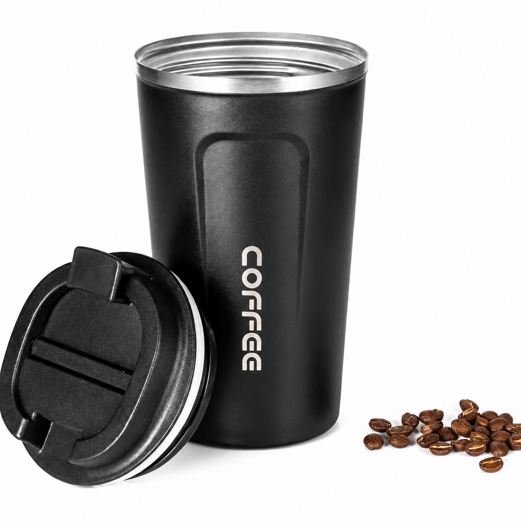 Black stainless steel travel coffee mug with flip lid open, coffee beans beside it"