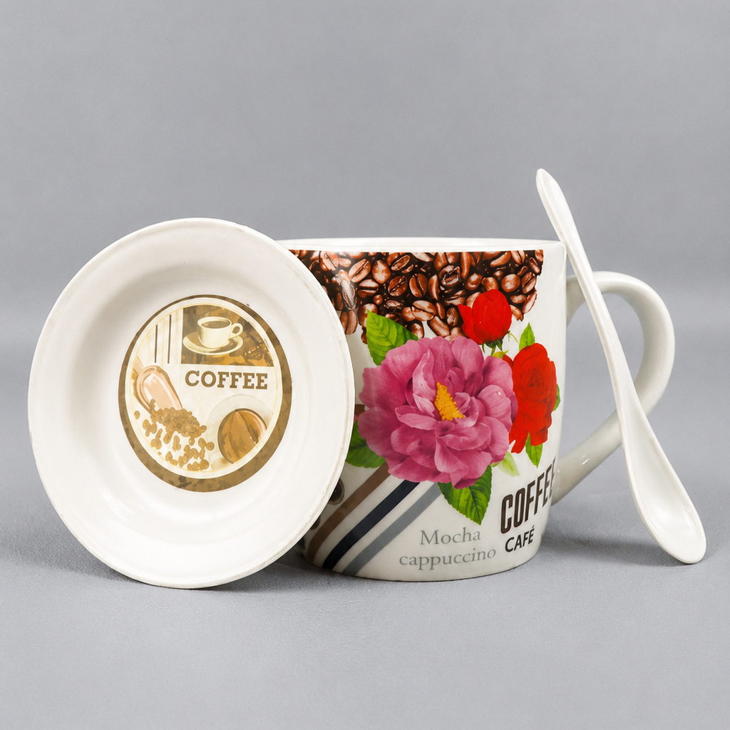 Coffee-themed mug with floral design, spoon, and coaster on a gray background
