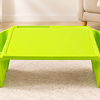 Lime green kids lap desk empty, front view on rug