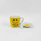 Yellow mug with smiley face and 'for you' text, accompanied by a matching coaster on a white background.