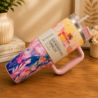 Stanley Quencher floral tumbler lying on side showing pink handle detail