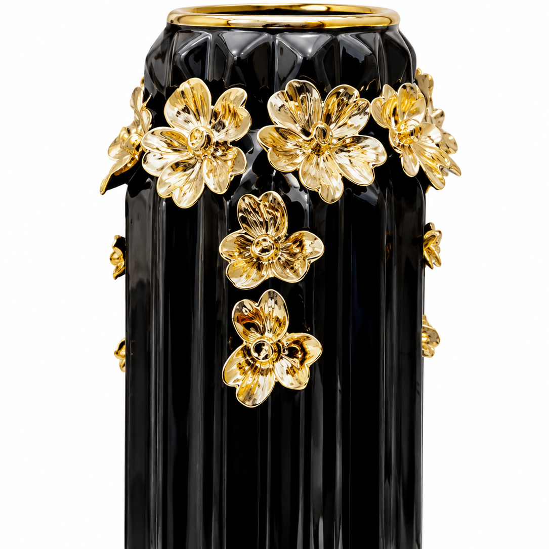 Black ceramic vase with gold flowers, front view on white background