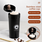 Open lid of stainless steel travel coffee mug showing rotating drink spout and wide-mouth cup opening